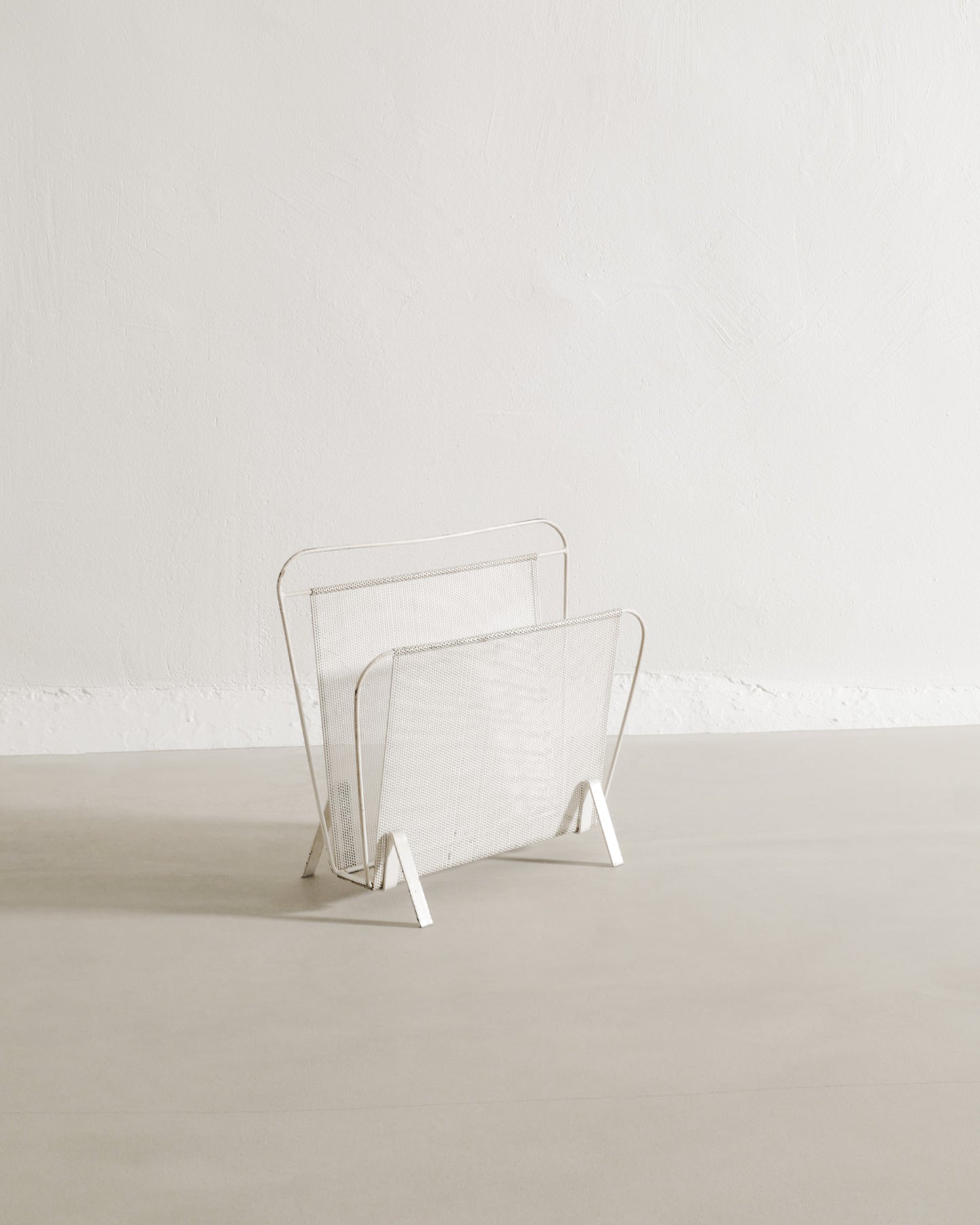 MATHIEU MATÉGOT MAGAZINE RACK, 1950s