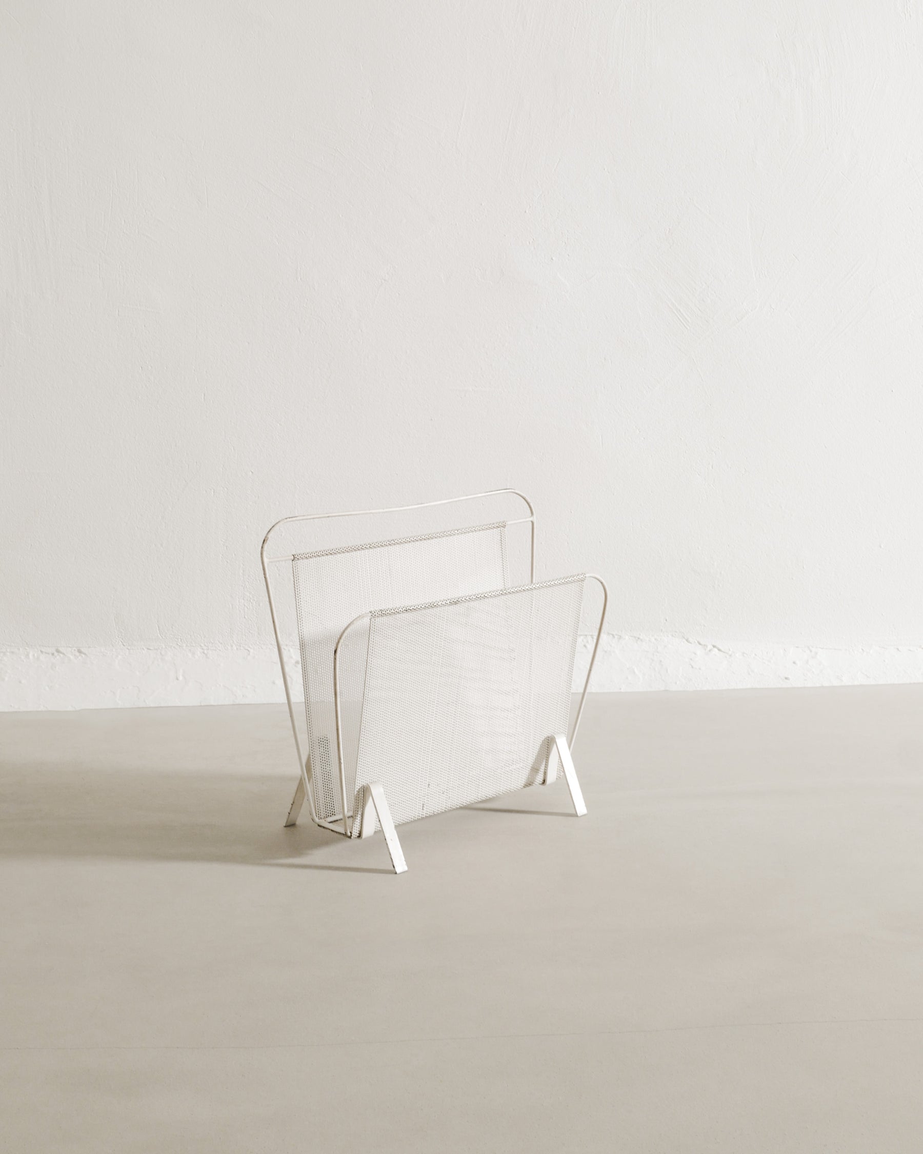 MATHIEU MATÉGOT MAGAZINE RACK, 1950s